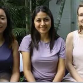 Women smiling for photo.